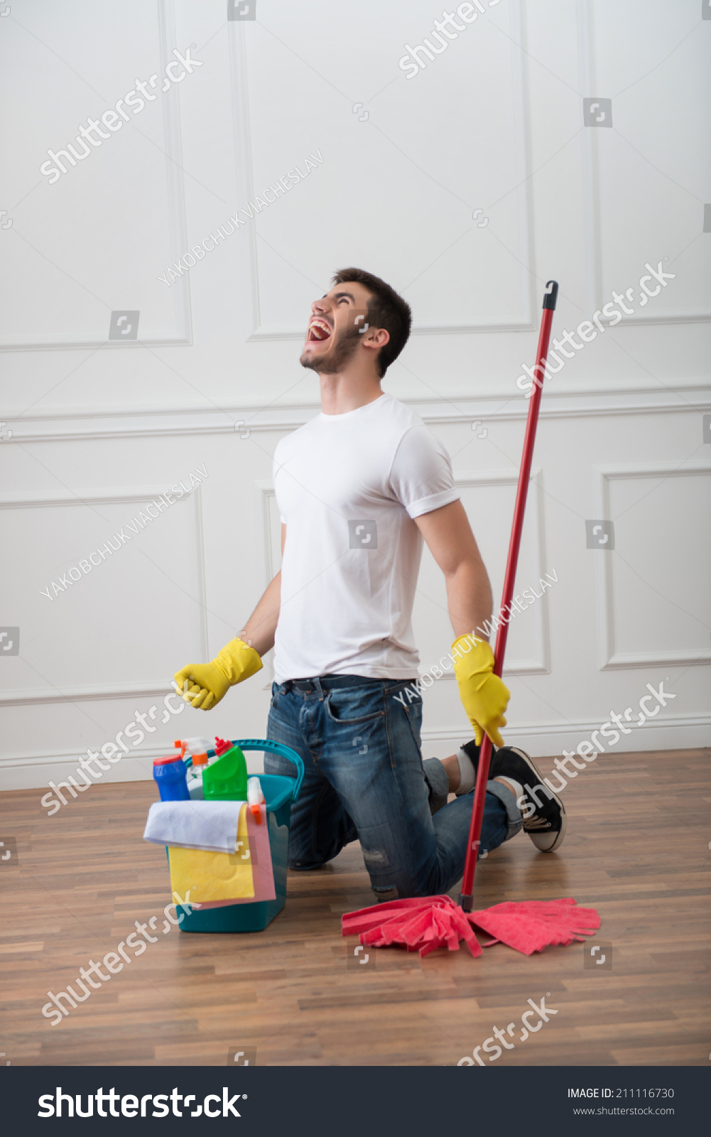 stock-photo-full-length-portrait-of-very-angry-dark-haired-janitor-wearing-white-shirt-blue-to...jpg