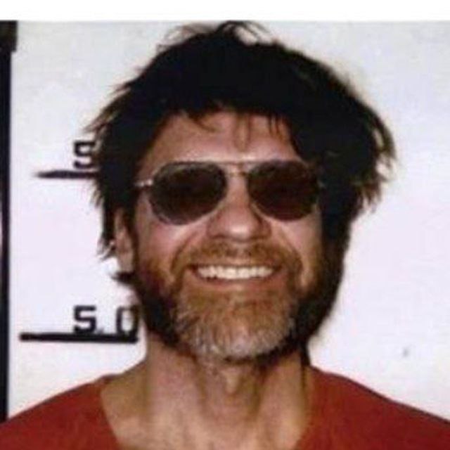 ted kaczynski with sunglasses smiling.jpg